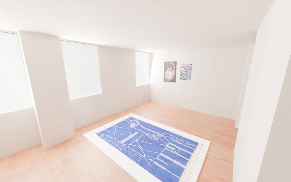Studio with warm wood floor and cream walls